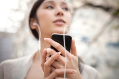lady listening with ear buds